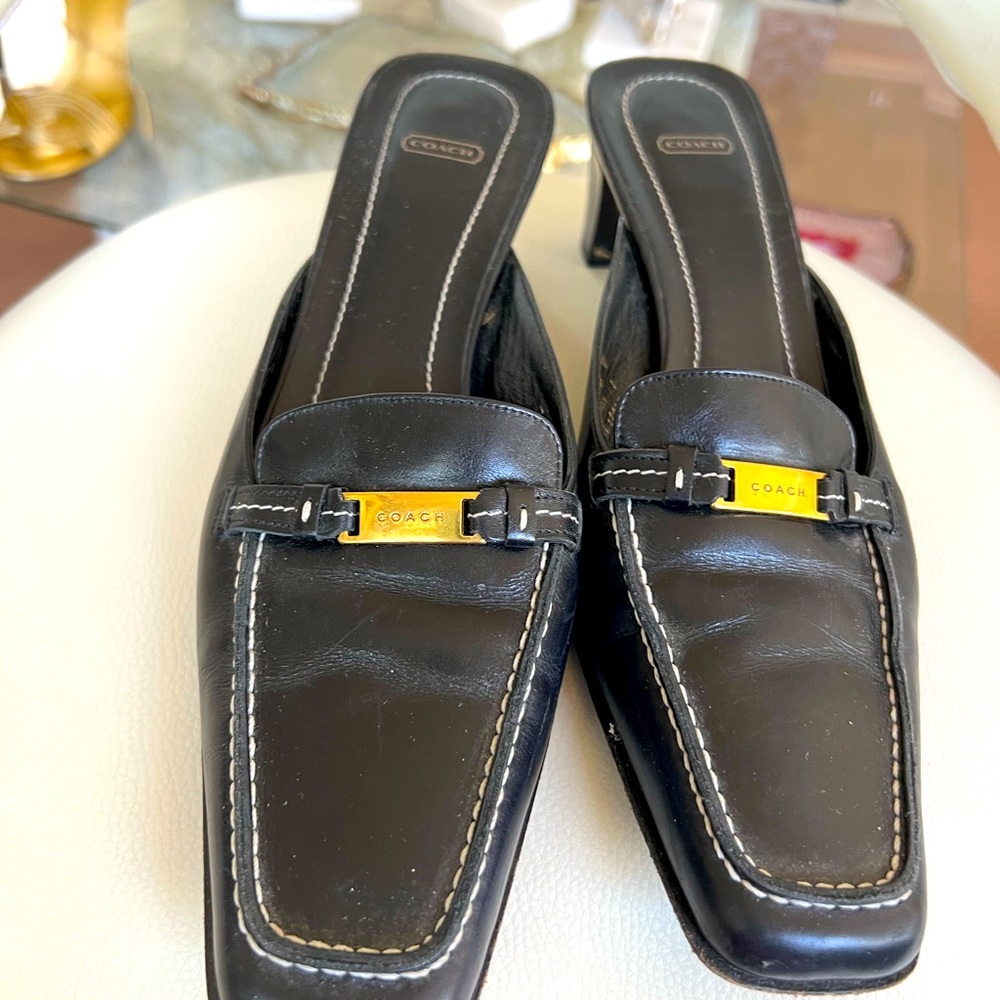 7B Coach Nina black leather mules with gold hardware